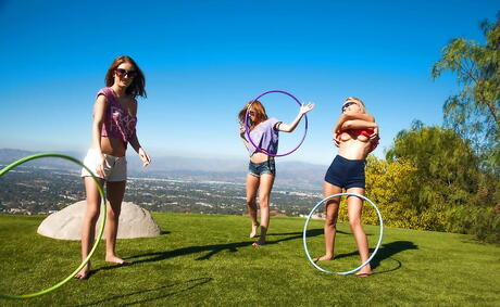 Stunning girls Emma Stoned, Maci Winslett and Staci Carr enjoy some playful lesbian foreplay outdoor