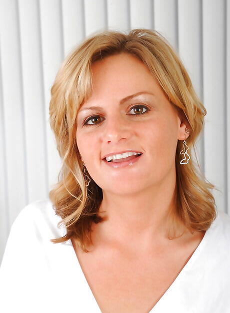 Enticing american milf Becca Blossoms in fancy pantyhose exposes big boobs and masturbates with sex toy 