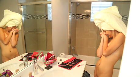 Luscious oriental youthful Layla Mynxx showing tiny tits and sexy butt in the bathroom