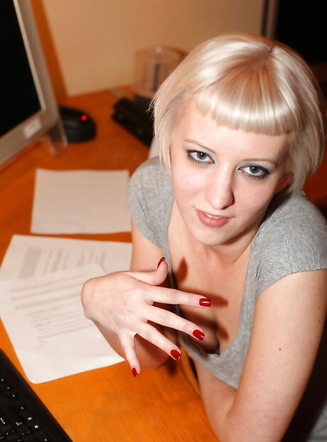 Foxy american blond youthful Cherry Torn exposing big titties and spreading her legs in office